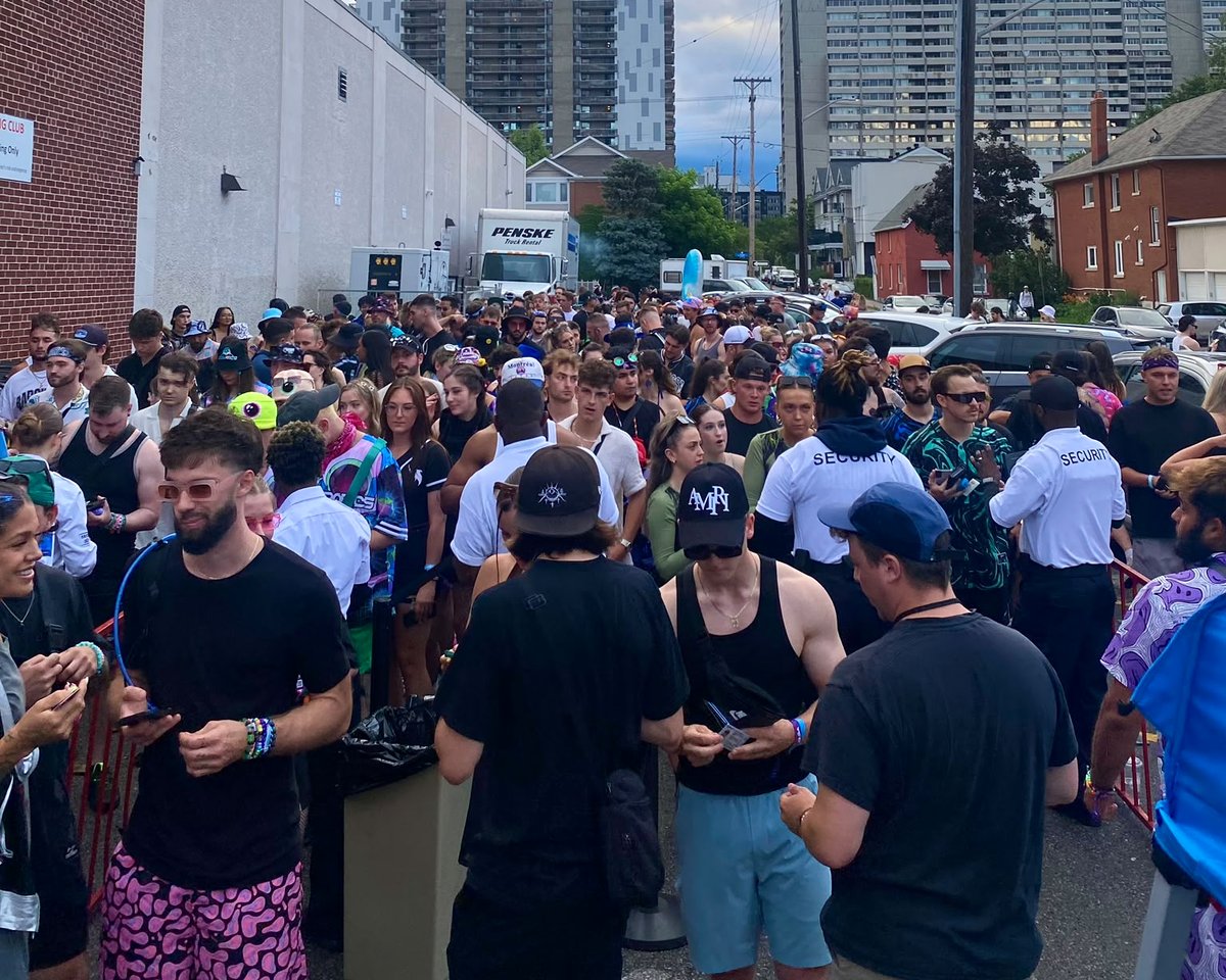 SafeHaven officers managing a large crowd lining up at an event entrance in Ottawa